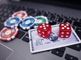 Live BandarQ dealer at erek 19 table with cards and gaming layout